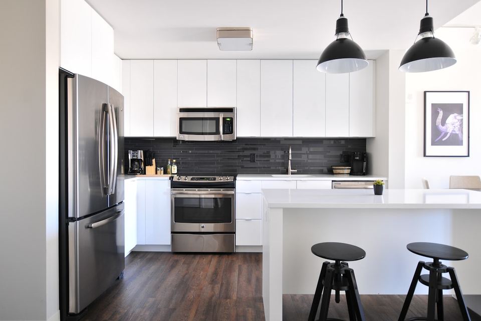 Bright, organised kitchen with clean countertops and open shelving